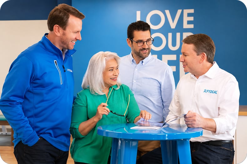 A group of people collaborating around a desk about their Q3 ground-breaking momentum