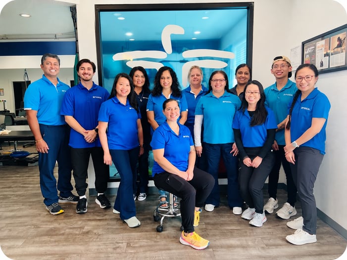 Noel Thomas, PT, and Jayne Thomas, Owners, FYZICAL Sugar Land and FYZICAL Harvest Green, Texas, with their staff. 