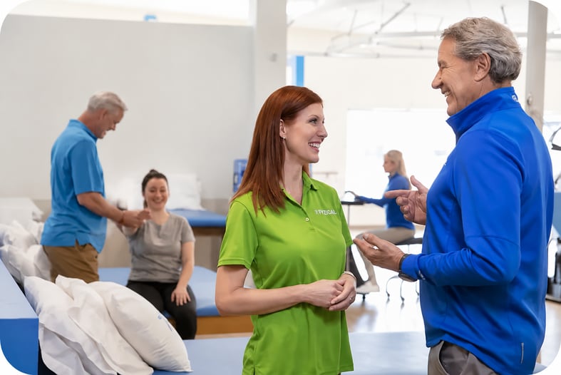 A picture of a woman in a green dress who is learning the steps to improve her private practice