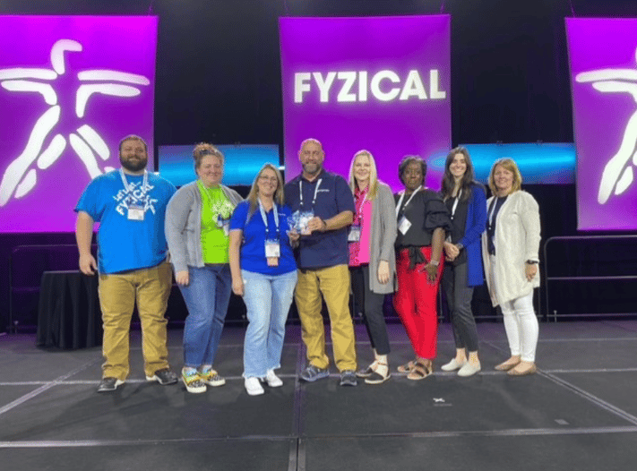 2023 FYZICAL Franchisee of the Year Jerry Yarborough, PT, DPT Master Franchisee and his team at FYZICAL Therapy & Balance Center's Brand Triumph.