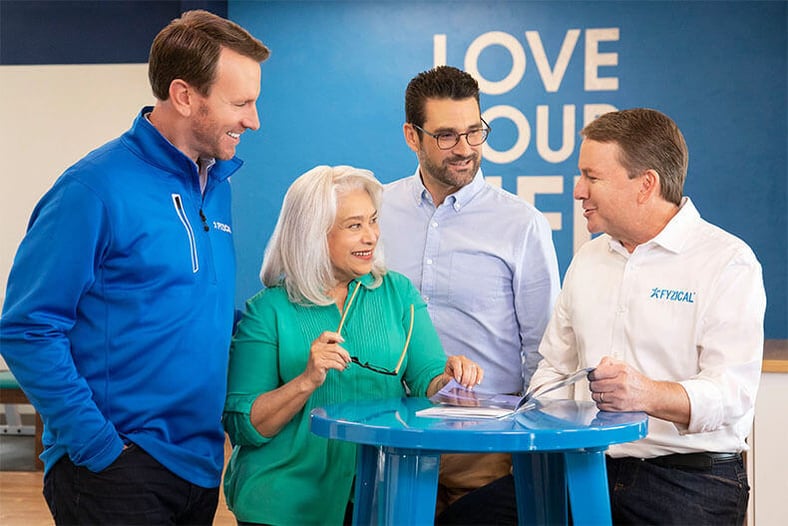 a group of people collaborating around a desk