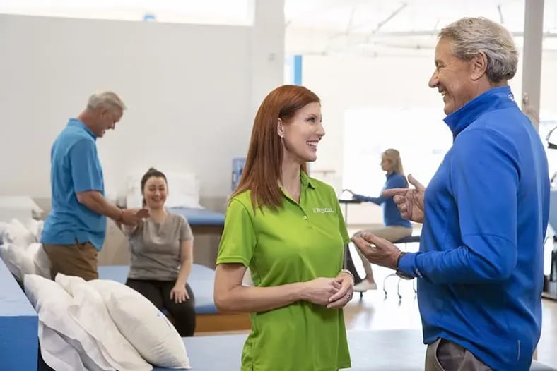 Physical Therapist talking to elder patient